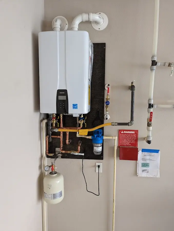 Professional plumber installing copper piping in a Gardiner home